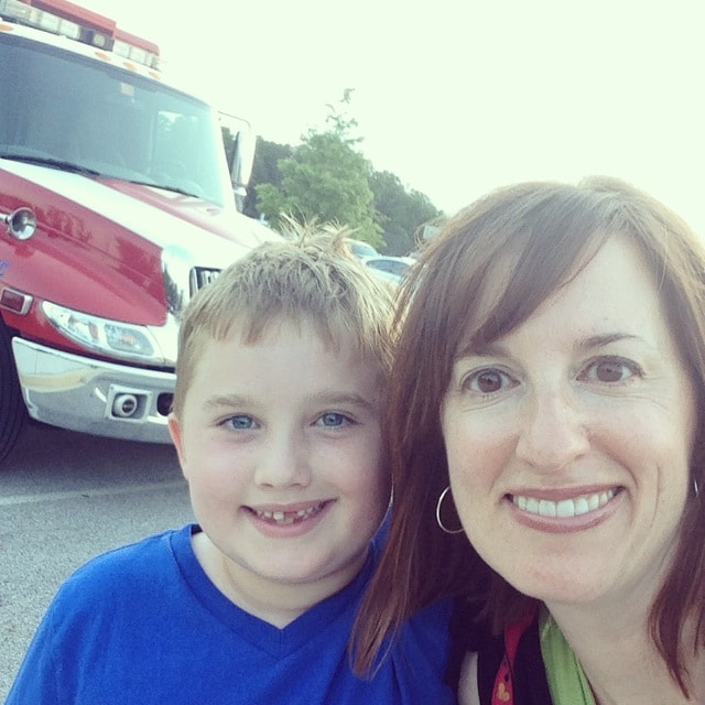 Fadra and son with a fire truck
