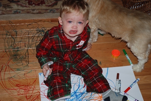 Baby making a mess with markers