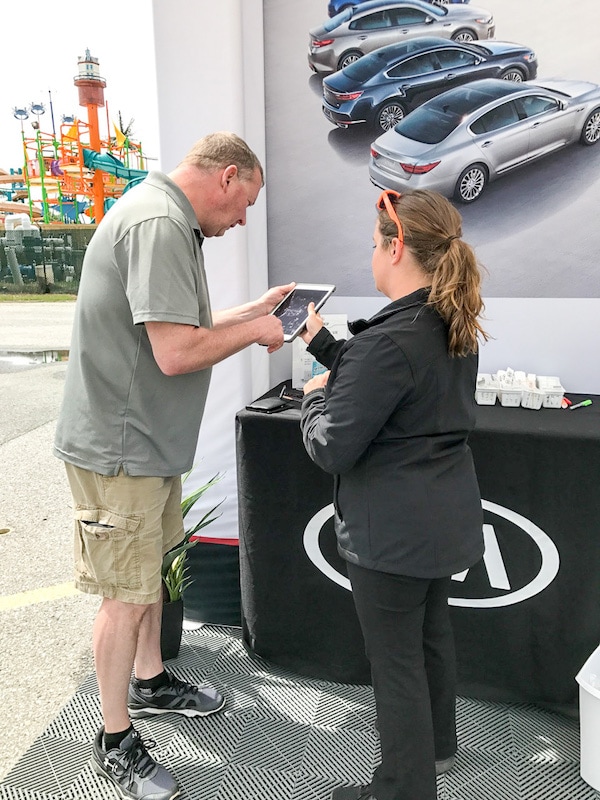 Sean signing up for the Kia Ride and Drive