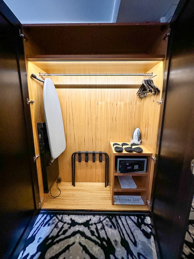 closet and ironing board in hotel