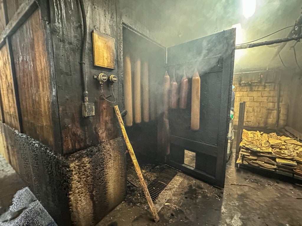 Lebanon bologna hanging in a smokehouse