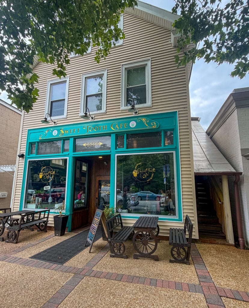 Charming cafe storefront with outdoor seating in Gloucester, Virginia.