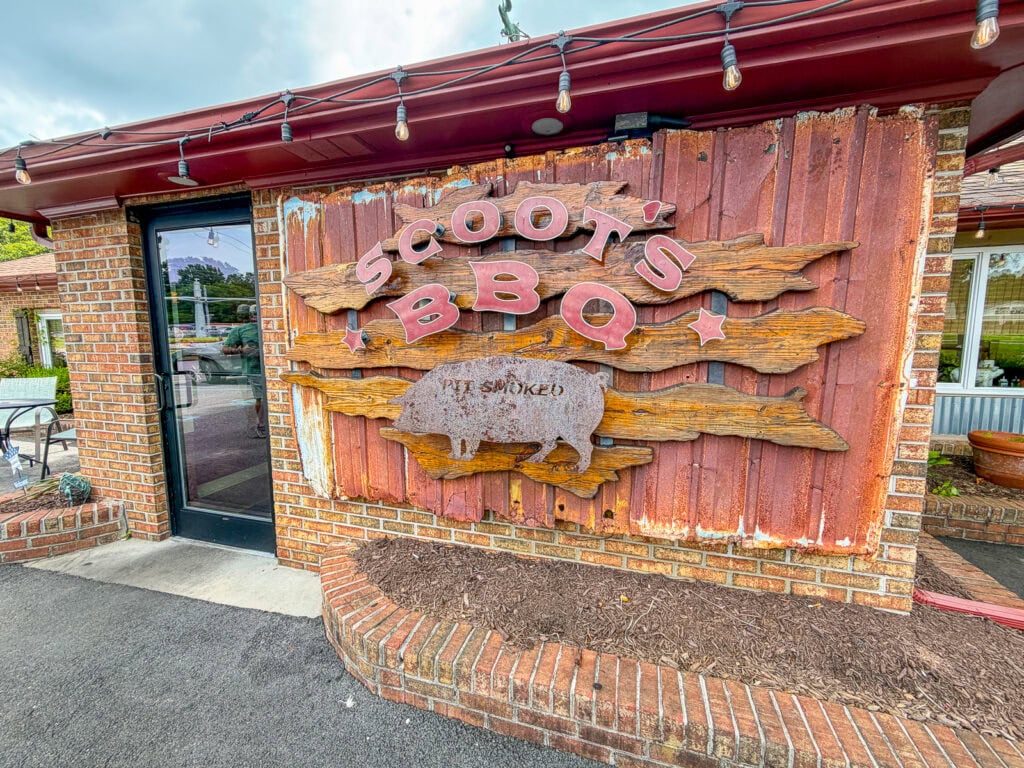 Scoot's BBQ sign on brick wall in Gloucester, Virginia.